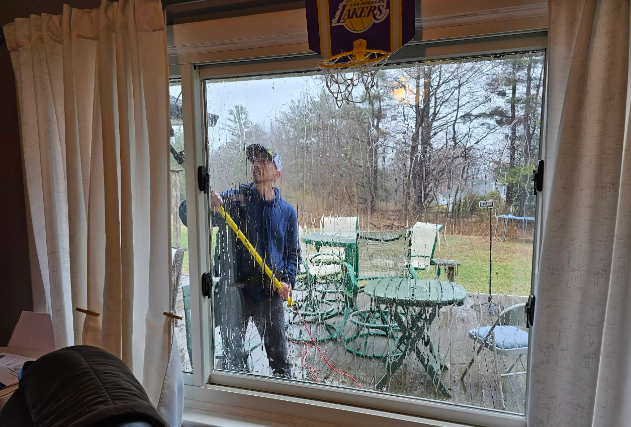 Exterior window cleaning on a residential sliding door